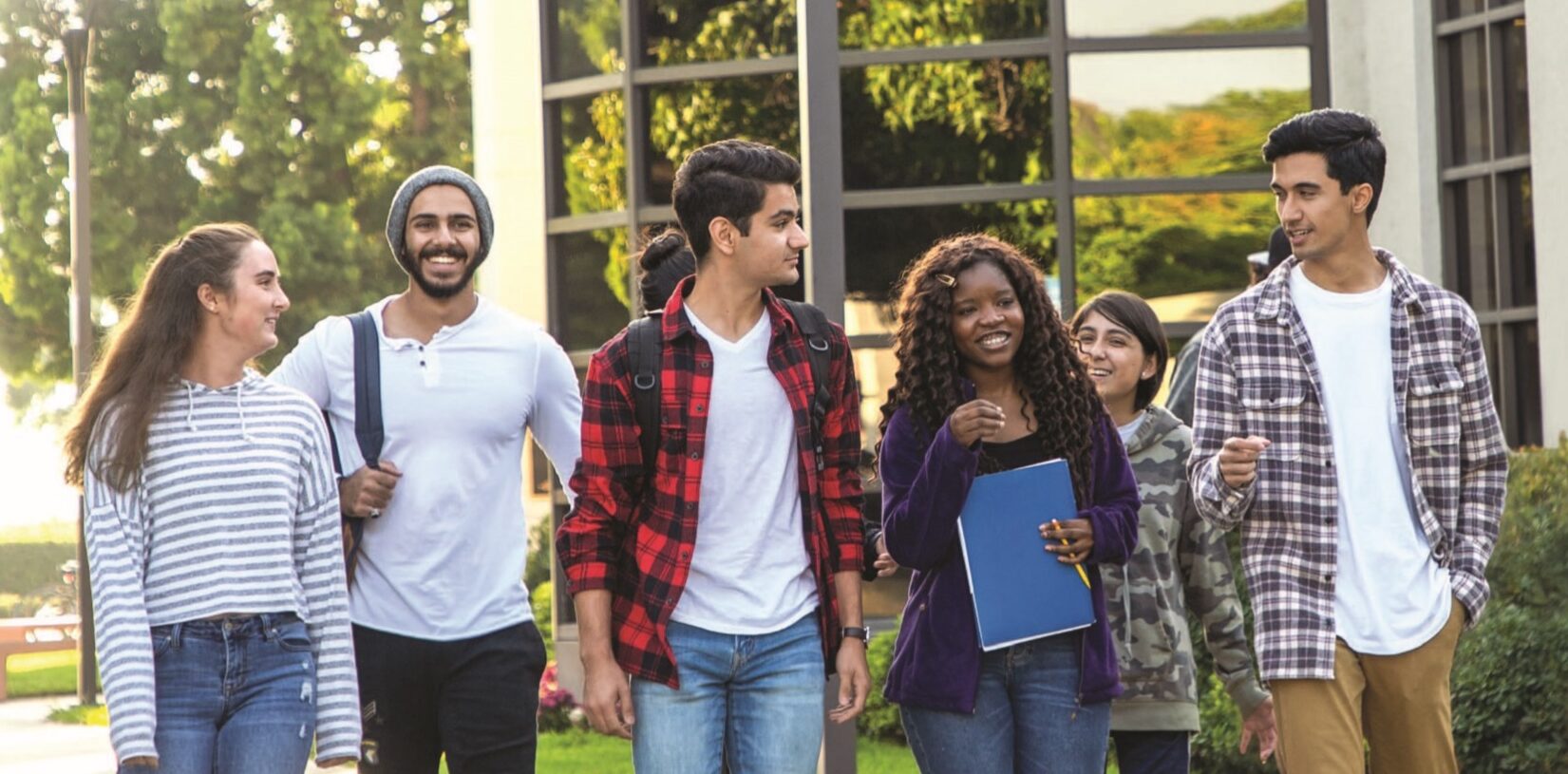 Image of five Irvine Valley community college students walking through campus.